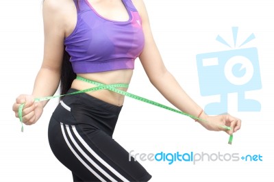 Woman In Sport Bra Measuring Her Body With Tape Isolated On Whit… Stock Photo