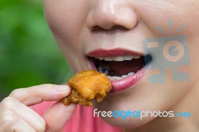 Woman Is Eating Fried Chicken Stock Photo