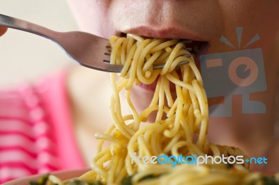 Woman Is Eating Spaghetti Stock Photo