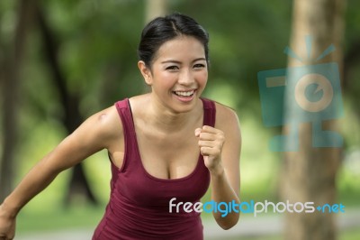 Woman Is Jogging Stock Photo