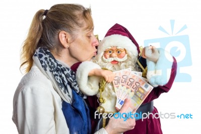 Woman Kissing Model Of Santa Claus Stock Photo