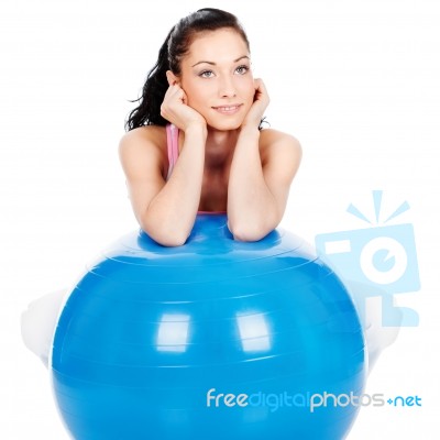 Woman Leaning On The Big Ball Stock Photo