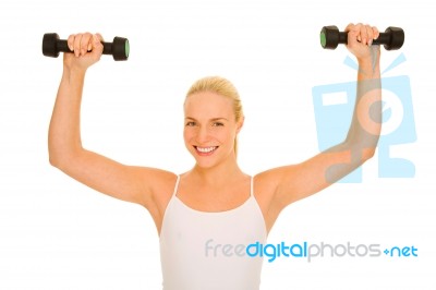 Woman Lifts Weights Stock Photo