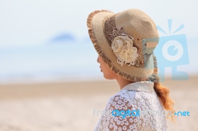 Woman Looking Into The Sea Stock Photo