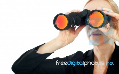 Woman Looking Through Binoculars Stock Photo