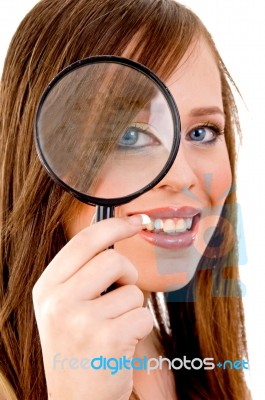 Woman Looking Through Lens Stock Photo