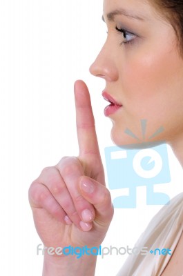 Woman Making Silence Gesture Stock Photo