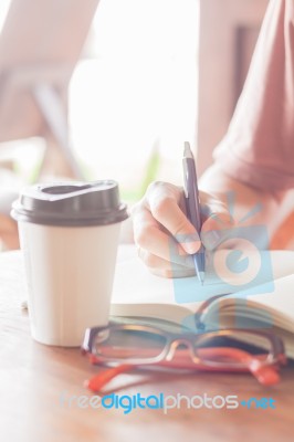 Woman Making Some Important Notes Stock Photo