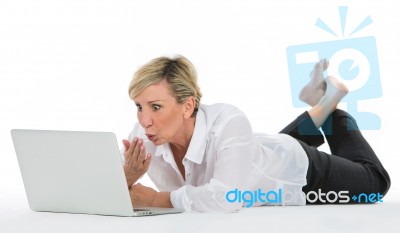 Woman Manager Sat On The Floor With Laptop Stock Photo