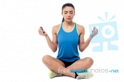 Woman Meditating In Pose Of Lotus Stock Photo