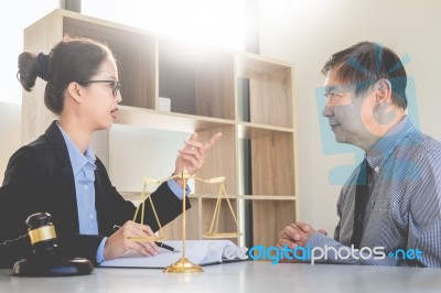 Woman Meeting Notary For Advice A Lawyer With Documents Discussi… Stock Photo