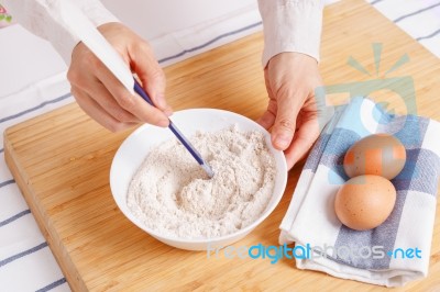 Woman Mixing Ground Flaxseed And Flour Stock Photo