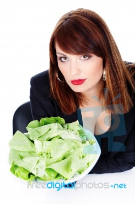 Woman Offering Green Salad Stock Photo