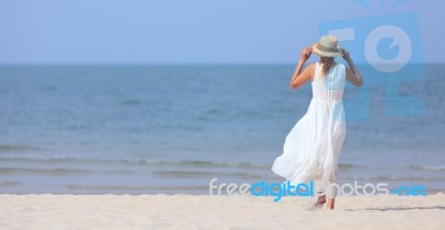 Woman On Beach Stock Photo