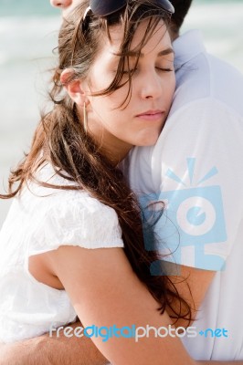 Woman On Her Husband Shoulder Stock Photo