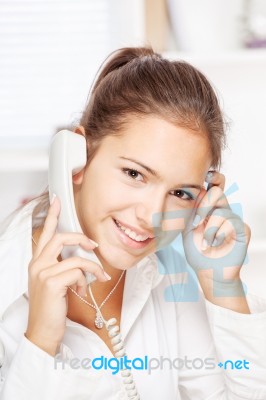 Woman On Land Line Call Stock Photo