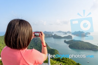 Woman On Peak Take Photos Stock Photo