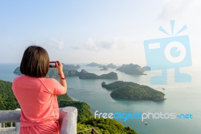 Woman On Peak Take Photos Stock Photo