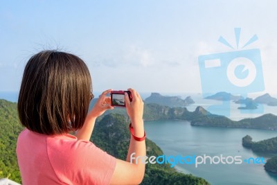 Woman On Peak Take Photos Stock Photo