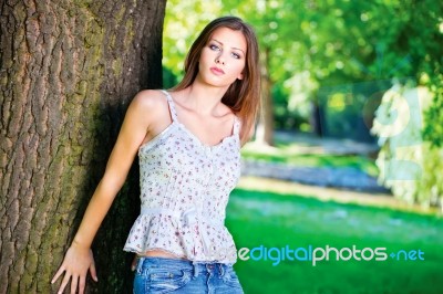 Woman On Sunny Day In Park Stock Photo