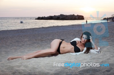 Woman On The Beach Stock Photo