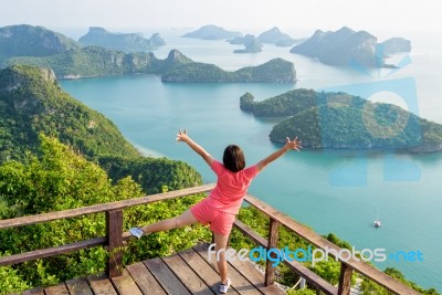 Woman On The Peak Mountain Stock Photo