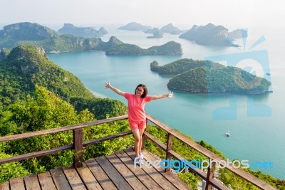 Woman On The Peak Mountain Stock Photo