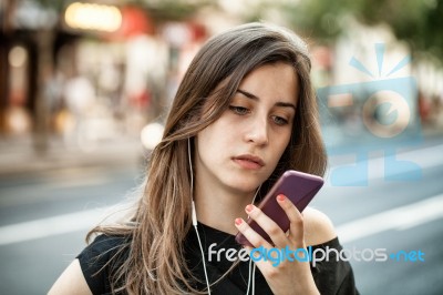 Woman On The Phone In The Street Stock Photo