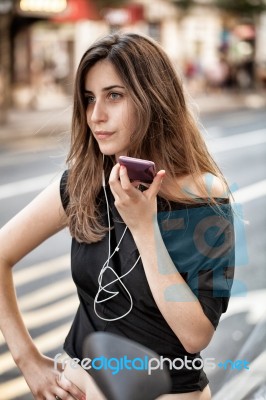 Woman On The Phone In The Street Stock Photo