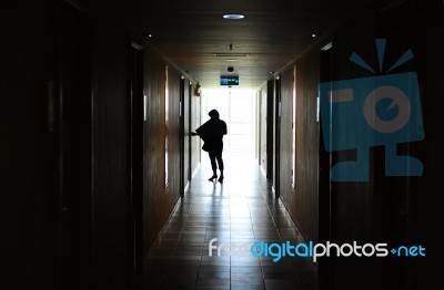 Woman Opening Door Stock Photo