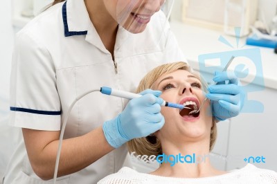 Woman Patient Undergoing A Dental Check Stock Photo