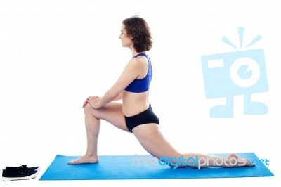 Woman Performing Aerobics, Indoor Studio Shot Stock Photo