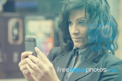 Woman Photographing With Cell Phone Stock Photo