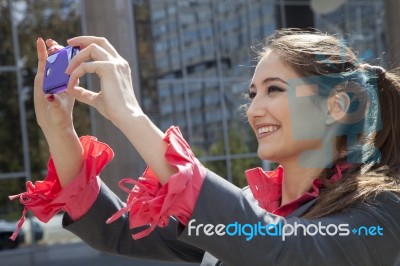 Woman Photographing With Mobile Phone Stock Photo