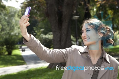 Woman Photographing With Mobile Phone Stock Photo