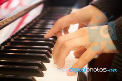 Woman Playing On Piano Keyboard Stock Photo