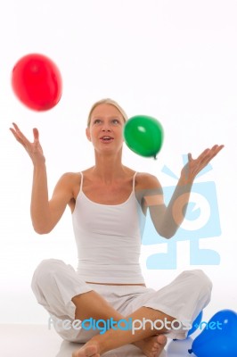 Woman Playing With Balloons Stock Photo