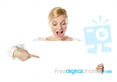 Woman Pointing At Blank Sign Stock Photo