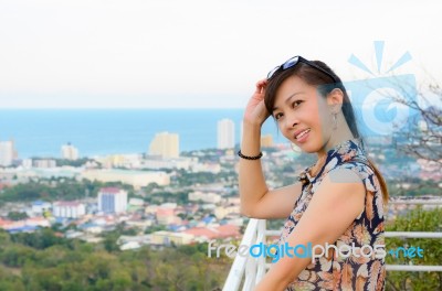 Woman Poses On A High Point Overlooking The City Stock Photo