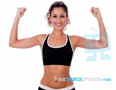 Woman Raising Her Hands Doing Exercises Stock Photo