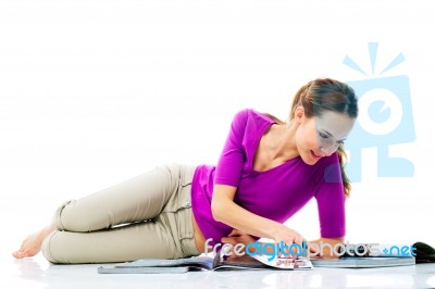 Woman Reading Magazines Stock Photo