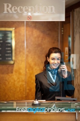 Woman Receptionist Talking Phone Stock Photo