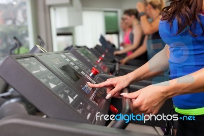 Woman Running On Treadmill Stock Photo