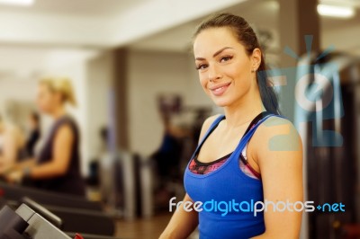 Woman Running On Treadmill Stock Photo