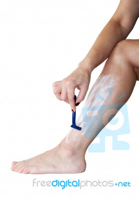 Woman Shaves Her Leg Stock Photo