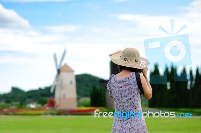 Woman Shooting Photo In Garden Stock Photo