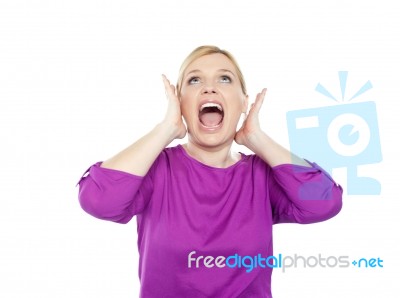 Woman Shouting With Hands On Ears Stock Photo