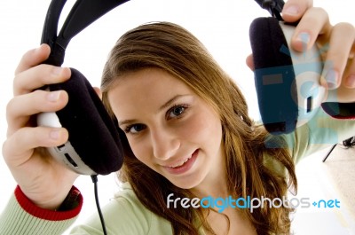 Woman Showing Headphone Stock Photo