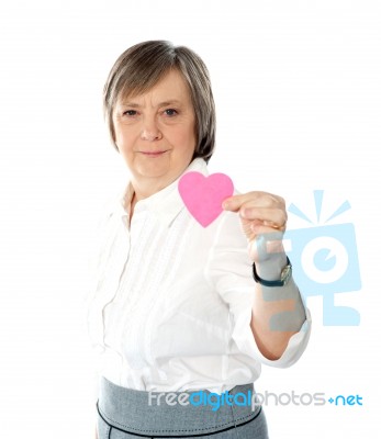 Woman Showing Heart Shaped Paper Stock Photo