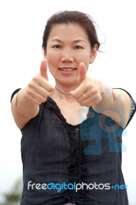 Woman Showing Thumb Stock Photo